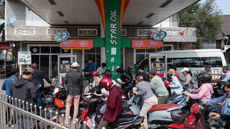 Motorists queue at a petrol station in Luang Prabang, Laos, following import disruptions caused by the Middle East war