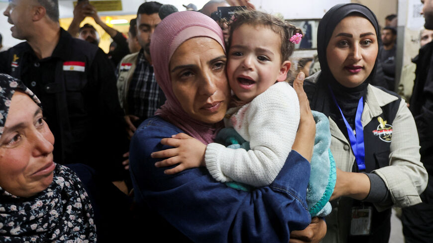 Family members reunite with a child who was evacuated from Gaza as a premature baby during the two-year Israeli offensive, and has returned after receiving medical treatment in Egypt, at Nasser Hospital in Khan Younis in the southern Gaza Strip, March 30, 2026. REUTERS/Ramadan Abed