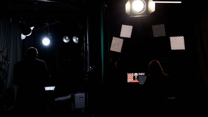 Journalists at the White House listen as U.S. President Donald Trump delivers an address to the nation about the Iran war, in Washington, D.C., U.S., April 1, 2026. REUTERS/Evan Vucci