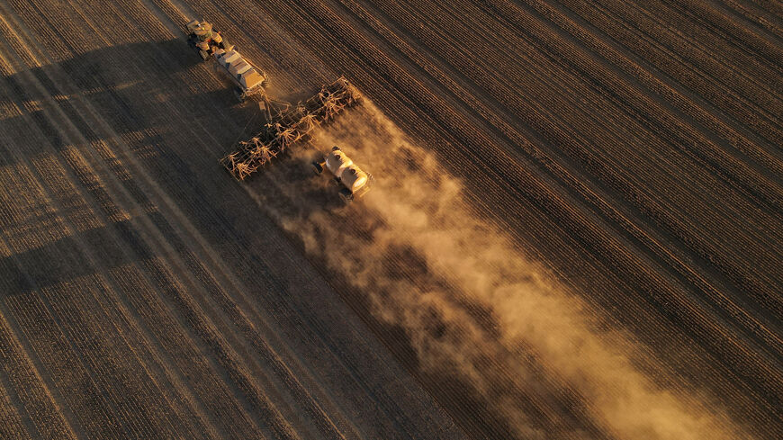 FILE PHOTO: A drone view of a seeder sowing wheat at a farm in Bencubbin, Australia, May 13, 2025. REUTERS/Hollie Adams/File Photo