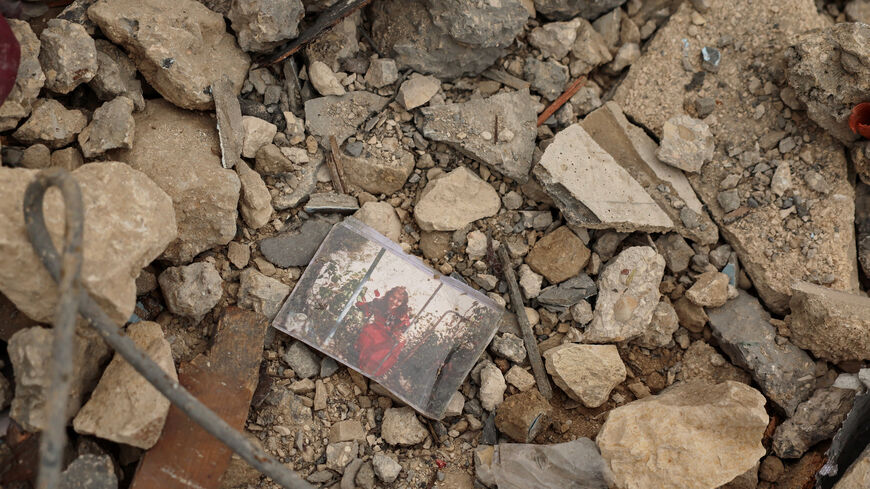 A photo lying among the rubble of a house destroyed by an Israeli strike, amid escalating hostilities between Israel and Hezbollah, as the U.S.-Israel conflict with Iran continues, in Houmine El Tahta, Lebanon, April 1, 2026. REUTERS/Yara Nardi     TPX IMAGES OF THE DAY