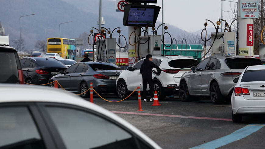 A man fills up his car at a gas station in Seoul, South Korea, March 9, 2026.   REUTERS/Kim Hong-Ji