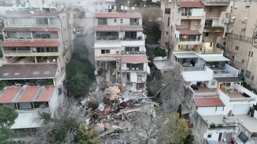 Emergency personnel work at the site following a reported Iranian missile strike in Haifa, Israel, April 5, 2026, amid the U.S.-Israeli conflict with Iran, in this screengrab from a drone video.    MDA HANDOUT/Handout via REUTERS