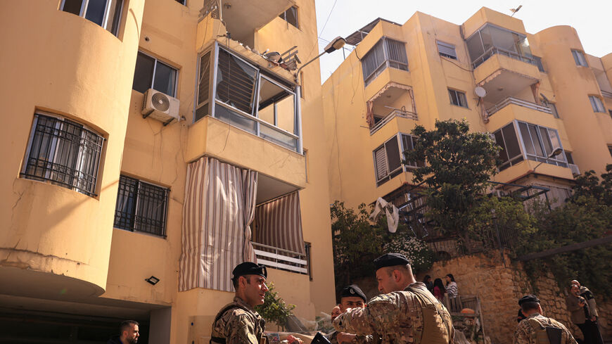 Lebanese Army servicemen stand near an apartment building hit by an Israeli strike amid escalating hostilities between Israel and Hezbollah, as the U.S.-Israel conflict with Iran continues, in Ain Saadeh, Lebanon, April 6, 2026. REUTERS/Raghed Waked