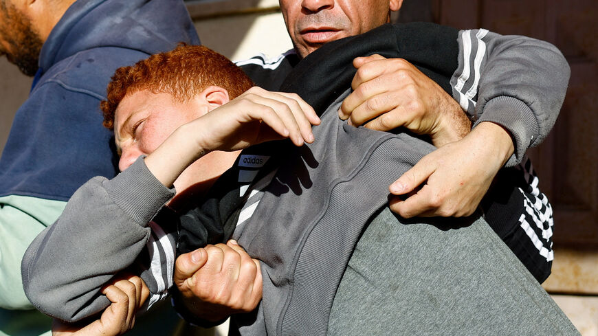 Palestinians react following an Israeli strike outside a school sheltering displaced people, according to medics, at Al-Aqsa Martyrs Hospital in Deir al-Balah in the central Gaza Strip, April 6, 2026. REUTERS/Mahmoud Issa