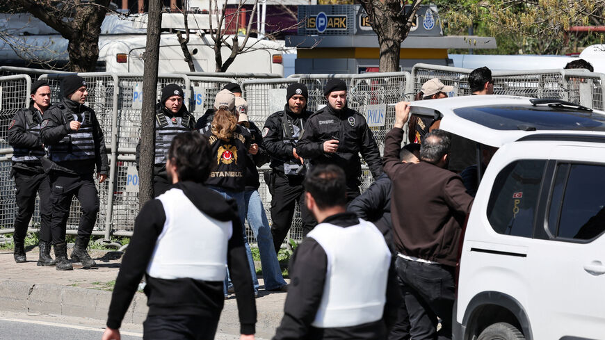 Police officers walk near the scene, after a gunfire was heard near the building housing the Israeli consulate, according to a witness, in Istanbul, Turkey, April 7, 2026. REUTERS/Umit Bektas