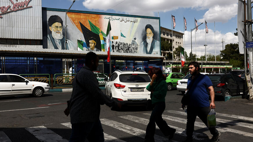 People walk on a street after U.S. President Donald Trump said that he had agreed to a two-week ceasefire with Iran, in Tehran, Iran, April 8, 2026. Majid Asgaripour/WANA (West Asia News Agency) via REUTERS