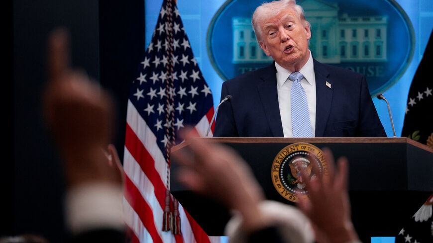 Reporters raise their hands to ask questions as U.S. President Donald Trump holds a press conference in the James S. Brady Press Briefing Room at the White House in Washington, D.C., U.S., April 6, 2026. REUTERS/Evan Vucci/File Photo