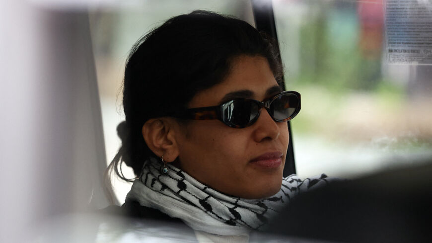 Member of the European Parliament, Rima Hassan of the French far-left opposition party La France Insoumise (France Unbowed - LFI), sits in a vehicle as she leaves after a hearing at the Paris judicial police offices, in Paris, France, April 3, 2026. REUTERS/Tom Nicholson