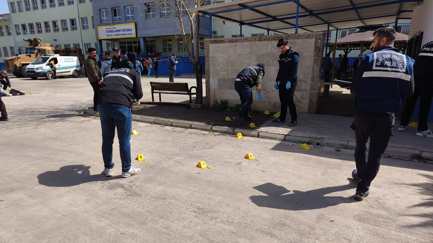 Forensic police officers search the site after a teenager opened fire at a school and wounded at least 16 people, including students and teachers, before killing himself in Siverek, Sanliurfa province, Turkey, April 14, 2026. REUTERS/Sukru Dolas