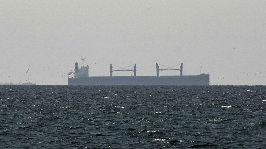 FILE PHOTO: A cargo ship in the Gulf, near the Strait of Hormuz, as seen from northern Ras al-Khaimah, near the border with Oman’s Musandam governance, amid the U.S.-Israeli conflict with Iran, in United Arab Emirates, March 11, 2026. REUTERS/Stringer/File Photo/File Photo