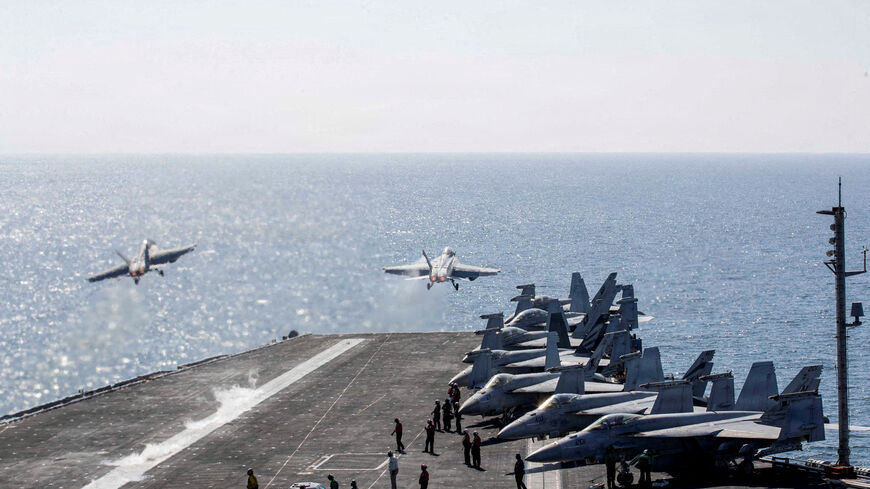 FILE PHOTO: Two F/A-18 Super Hornets launch from the flight deck of the U.S. Navy Nimitz-class aircraft carrier USS Abraham Lincoln in support of the Operation Epic Fury attack on Iran from an undisclosed location March 3, 2026. U.S. Navy/Handout via REUTERS  THIS IMAGE HAS BEEN SUPPLIED BY A THIRD PARTY/File Photo