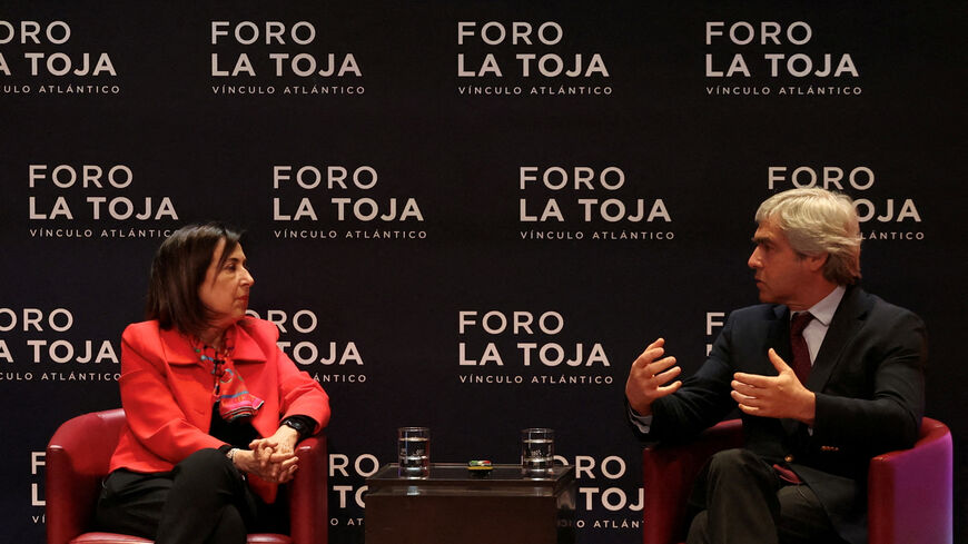 FILE PHOTO: Portuguese Defence Minister, Nuno Melo speaks with Spanish Defence Minister Margarita Robles during the La Toja Forum on global challenges in Lisbon, Portugal, April 1, 2025. REUTERS/Pedro Nunes/File Photo