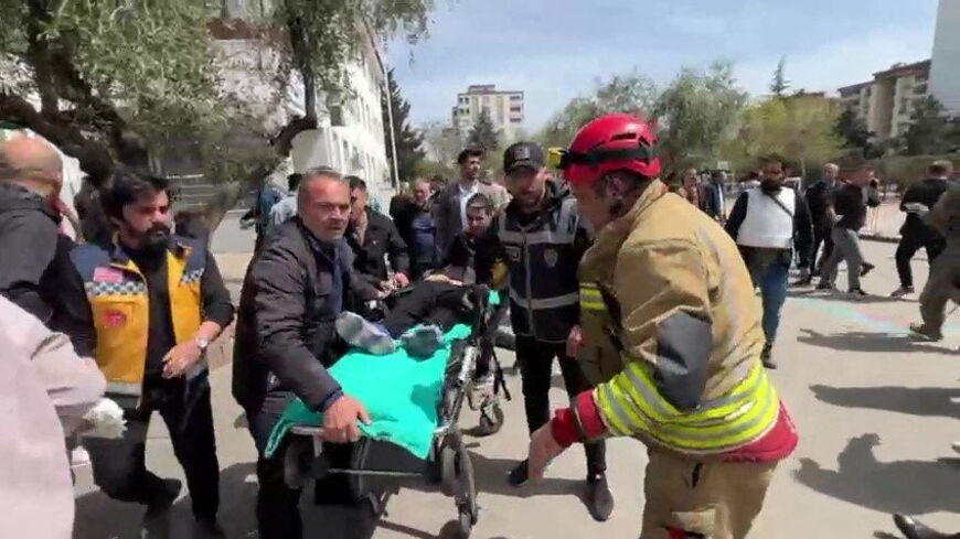 An injured person is carried to an ambulance following a school shooting, in the southeastern province of Kahramanmaras, Turkey, April 15, 2026. IHA (Ihlas News Agency) via REUTERS