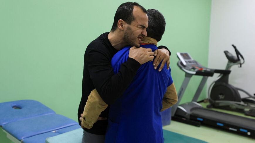Palestinian amputee Omar Abu Ali, 34, who was injured in an Israeli strike, undergoes a therapy session assisted by a medical worker at Sheikh Hamad bin Khalifa Al-Thani Rehabilitation and Prosthetics Hospital, in Gaza City, March 31, 2026. REUTERS/Dawoud Abu Alkas