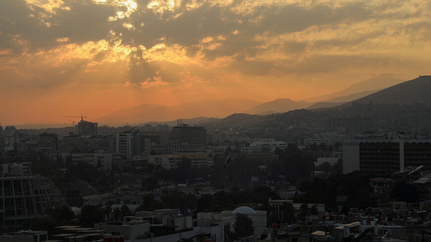 The sun sets over the skyline of Damascus, Syria, November 18, 2025. REUTERS/Orhan Qereman