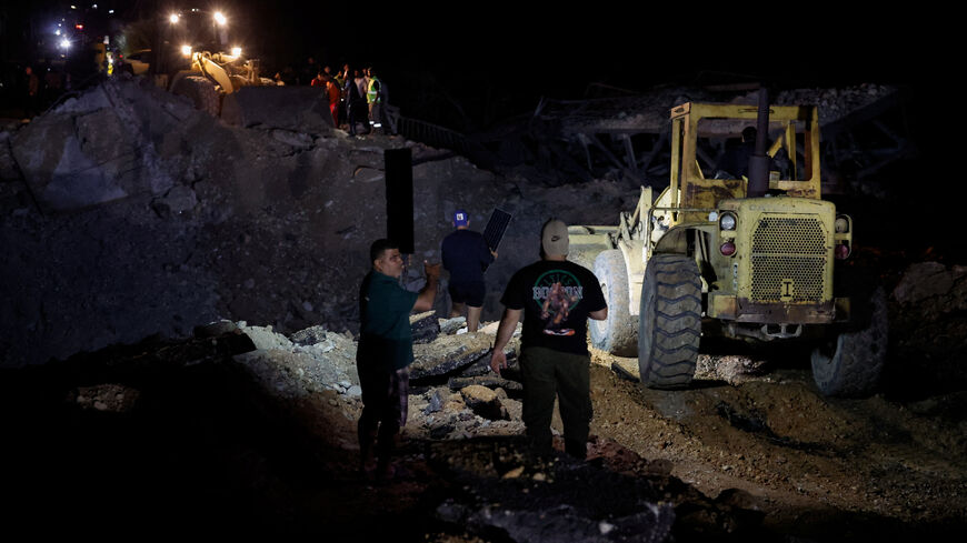 People work to repair the bridge linking southern Lebanon to the rest of the country, which was hit earlier in an Israeli strike, after a 10-day ceasefire between Lebanon and Israel went into effect, in Qasmiyeh, Lebanon, April 17, 2026. REUTERS/Louisa Gouliamaki     TPX IMAGES OF THE DAY