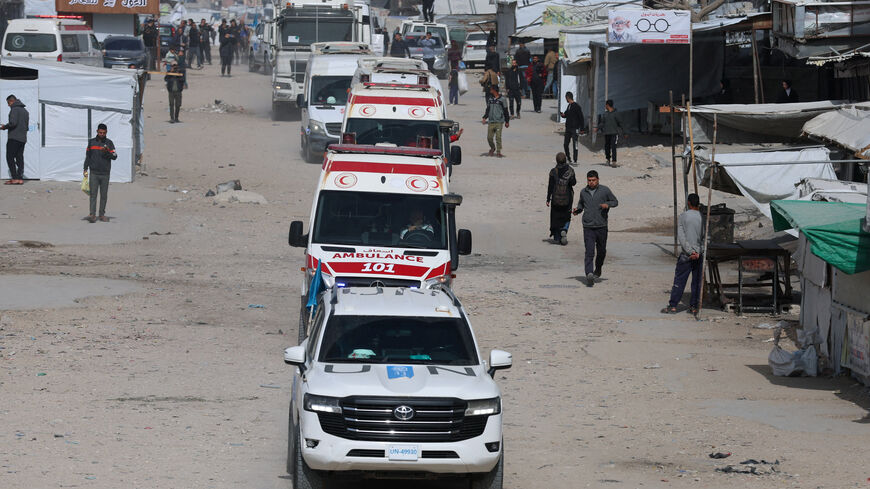 A UN vehicle leads ambulances carrying war-wounded people and patients who leave Gaza, for treatment abroad, through the Rafah border crossing between Gaza and Egypt after it was opened by Israel on Thursday for a limited number of people, in Khan Younis in the southern Gaza Strip, March 19, 2026. REUTERS/Ramadan Abed
