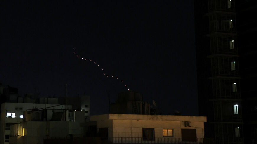 Streaks of tracer fire illuminate the sky as people celebrate after U.S. President Donald Trump said that Israel and Lebanon agreed to a 10-day ceasefire, as seen from Beirut, Lebanon, April 17, 2026. REUTERS/Saleh Salem     TPX IMAGES OF THE DAY