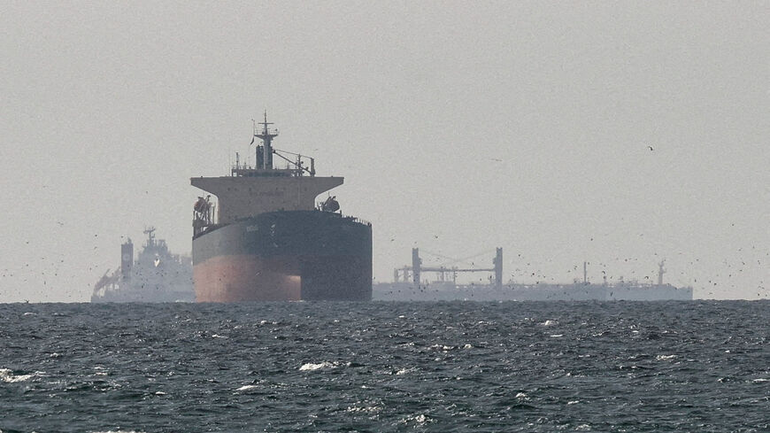 FILE PHOTO: Cargo ships in the Gulf, near the Strait of Hormuz, as seen from northern Ras al-Khaimah, near the border with Oman’s Musandam governance, amid the U.S.-Israeli conflict with Iran, in United Arab Emirates, March 11, 2026. REUTERS/Stringer/File Photo