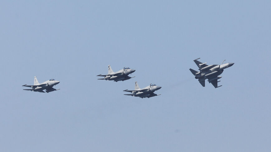 FILE PHOTO: Pakistan Air Force's JF-17 Thunder jets fly past during the sea phase of Pakistan Navy's Multinational Exercise AMAN-23, in the North Arabian Sea near Karachi, Pakistan, February 13, 2023. REUTERS/Akhtar Soomro/File Photo