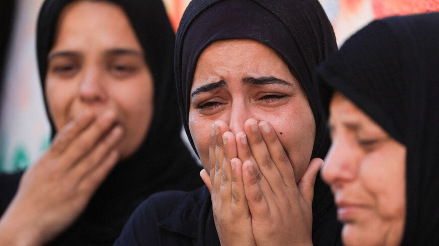Women mourn during the funeral of Palestinians, who were killed in an Israeli strike, according to medics, at Al-Shifa Hospital in Gaza City, April 23, 2026. REUTERS/Dawoud Abu Alkas