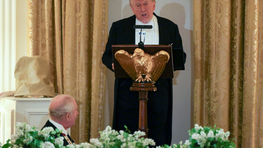 Britain's King Charles listens as U.S. President Donald Trump speaks during a state dinner for the King and Queen Camilla at the White House in Washington, D.C., U.S., April 28, 2026. REUTERS/Suzanne Plunkett