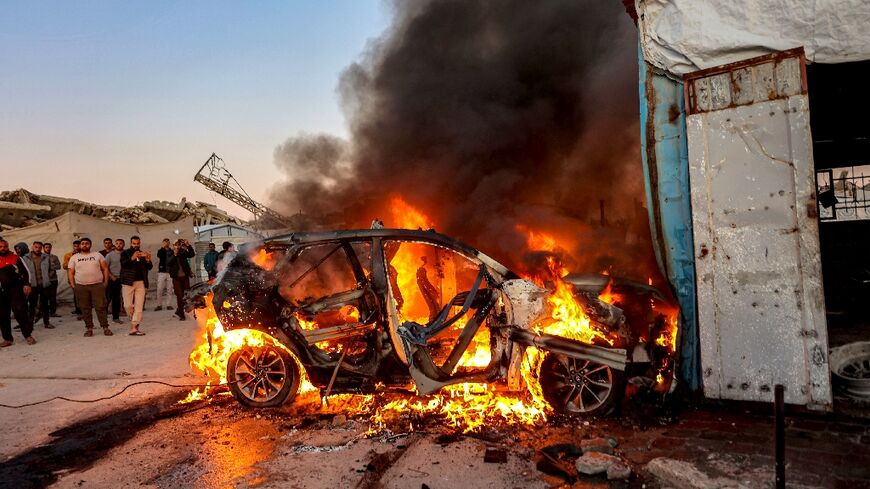 Flames rise after a strike on the vehicle of Palestinian journalist Mohammed Wishah in southern Gaza City on April 8, 2026