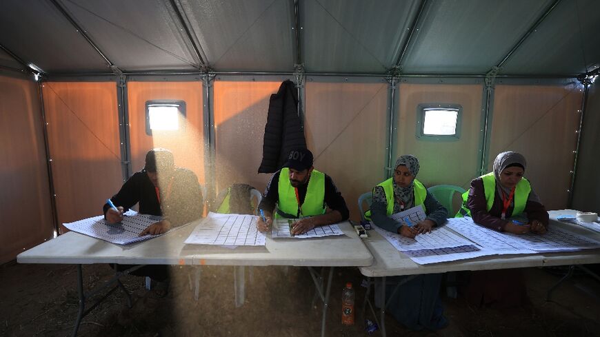 Electoral workers begin the count after voting closed in Deir el-Balah in Gaza