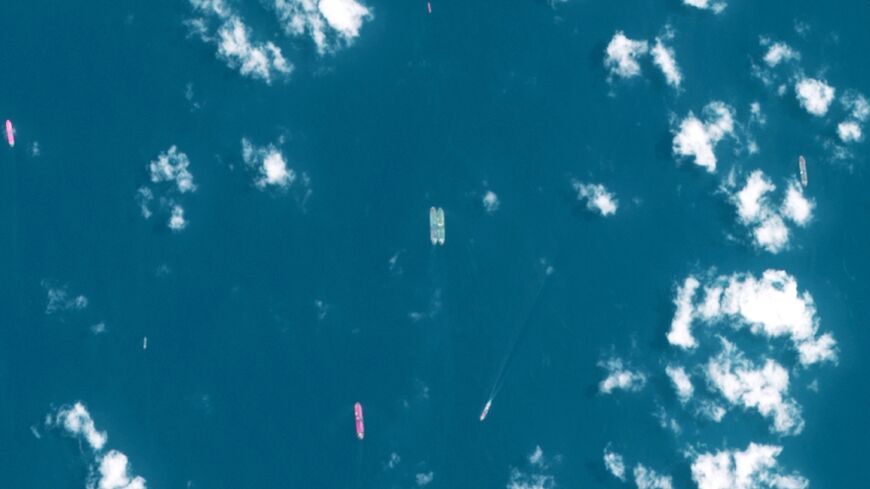 This handout satellite image released by the European Space Agency (ESA) shows two vessels conducting what appears to be an offshore cargo transfer off the southeast coast of the Malay Peninsula near Singapore on April 3