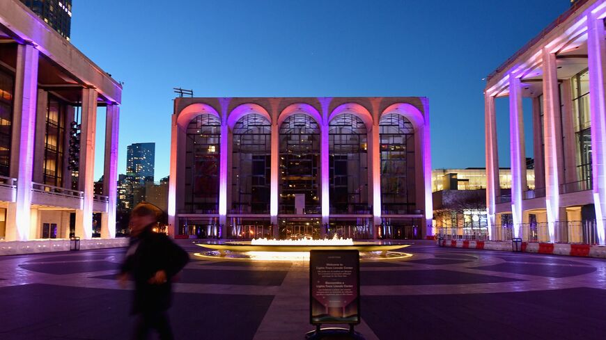 A person walks past the closed Metropolitan Opera at Lincoln Center on Jan. 7, 2021, in New York City.