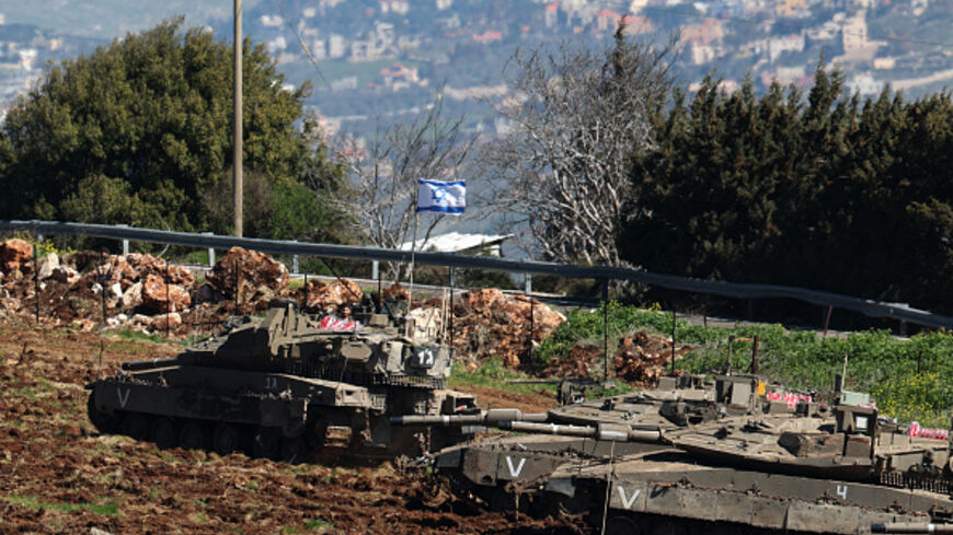 Israeli tanks gather at a position along the Israel-Lebanon border on March 8, 2026. (Jack GUEZ / AFP via Getty Images)