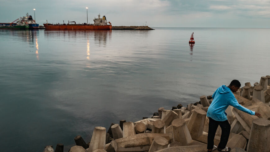 A bulk carrier sits anchored at Sultan Qaboos Port on March 23, 2026 in Muscat, Oman. 