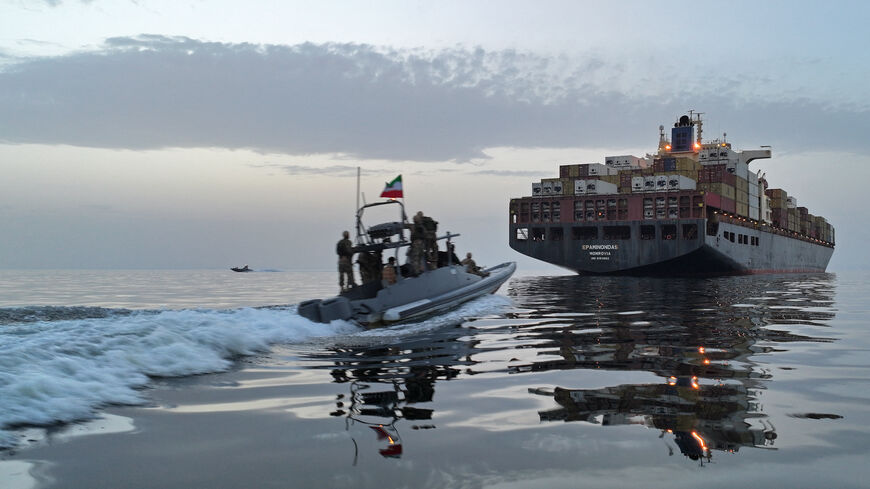 This photo obtained by AFP from the Iranian news agency Tasnim shows an Islamic Revolutionary Guard Corps (IRGC) boat allegedly taking part in an operation to seize ships attempting to cross the Strait of Hormuz, on April 21, 2026. 