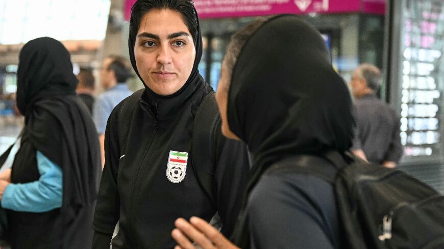 Iranian women's football team captain Zahra Ghanbari (L) changed her mind over the asylum bid