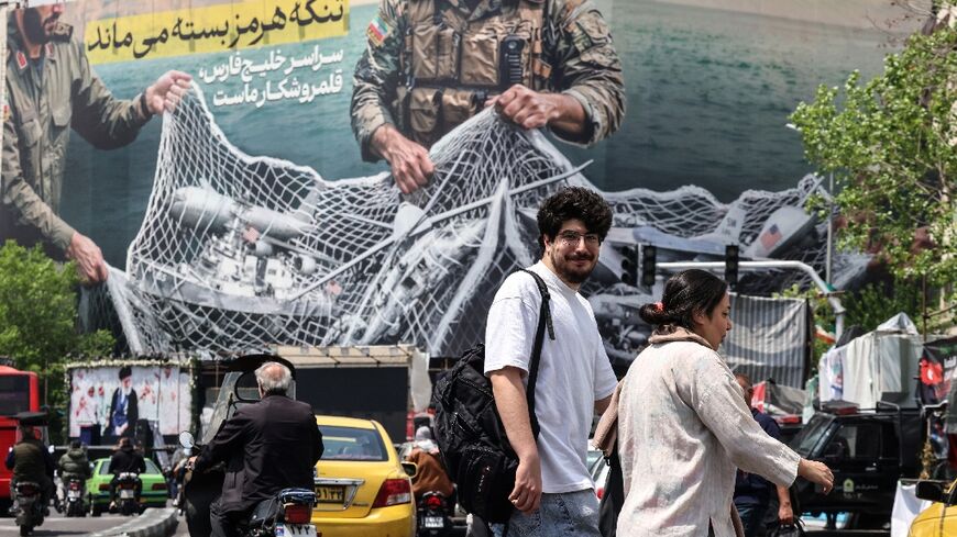 "The Strait of Hormuz remains closed," reads a giant billboard in Tehran