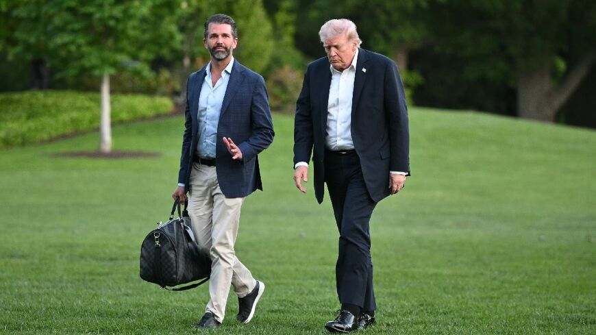 US President Donald Trump, here with his son Donald Trump Jr., said US forces would soon start escorting ships out of the Strait of Hormuz