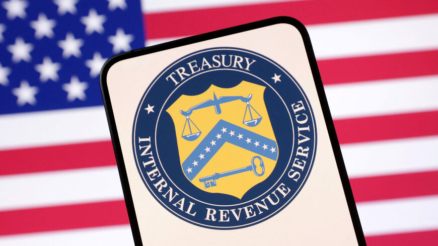 United States Department of the Treasury logo and U.S. flag are seen in this illustration taken April 23, 2025. REUTERS/Dado Ruvic/Illustration