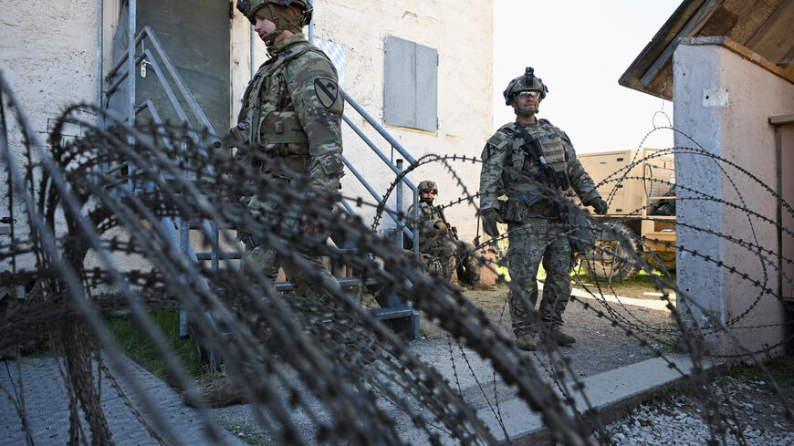 Soldiers stand next to a razor wire at a media day during the U.S. Army Combined Resolve exercise at the U.S. Army's southern Germany training facilities in Hohenfels, Germany, April 30, 2026. REUTERS/Angelika Warmuth