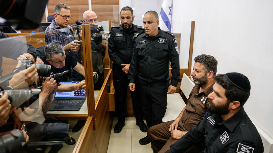 Activist Saif Abu Keshek, a member of the Global Sumud Flotilla detained by Israel, sits at a magistrate's court for a detention extension hearing in Ashkelon, southern Israel, May 3, 2026. REUTERS/Amir Cohen