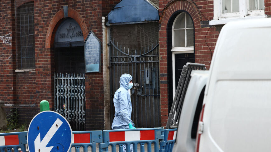 A forensics officer works at the scene of a suspected arson attack on a former synagogue in London, Britain May 5, 2026. REUTERS/Jack Taylor