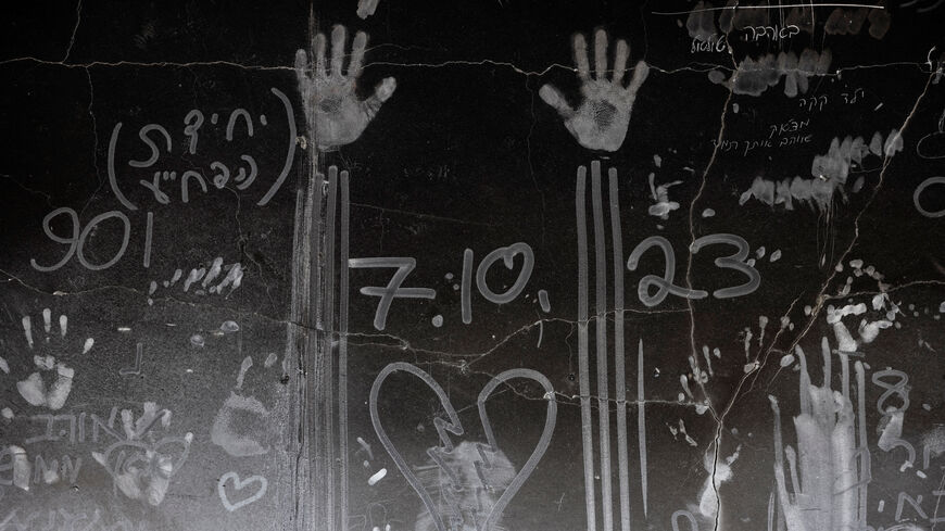 Hand prints and other markings made in the soot on a wall are seen, nearly a year since the deadly October 7 attack by Hamas, in Kibbutz Beeri, southern Israel, September 15, 2024. REUTERS/Amir Cohen