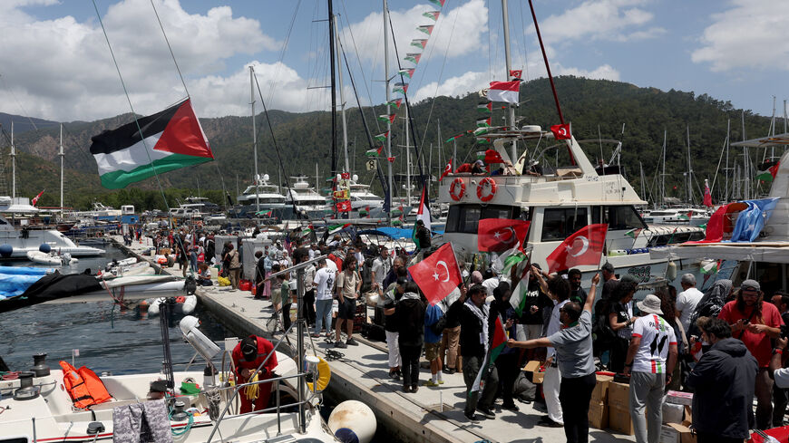Activists from the Global Sumud Flotilla, aiming to reach Gaza and break Israel’s naval blockade, gather at a port before their departure in the southern Turkish resort of Marmaris, Turkey, May 14, 2026. REUTERS/Dilara Senkaya