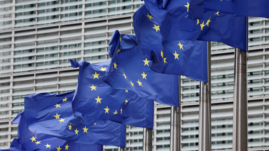 FILE PHOTO: European Union flags flutter outside the EU Commission headquarters, on the day farmers protest against proposed cuts to Common Agricultural Policy (CAP) funding and the European Commission's plan to merge agricultural and cohesion policies, in Brussels, Belgium July 16, 2025. REUTERS/Yves Herman/File Photo