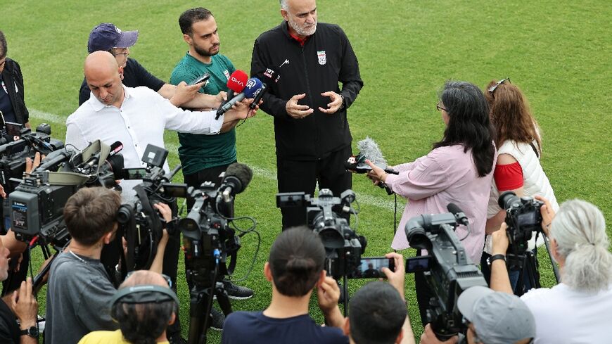 The vice-president of the Iranian Football Federation, Mahdi Mohammad Nabi, speaks to the media during a training session in Turkey