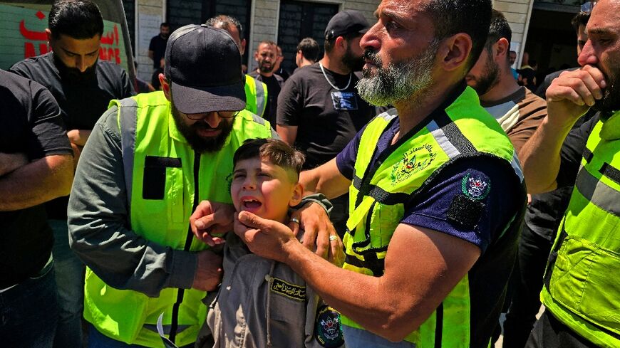 Mourners at the funeral of victims killed in an Israeli strike near Tyre