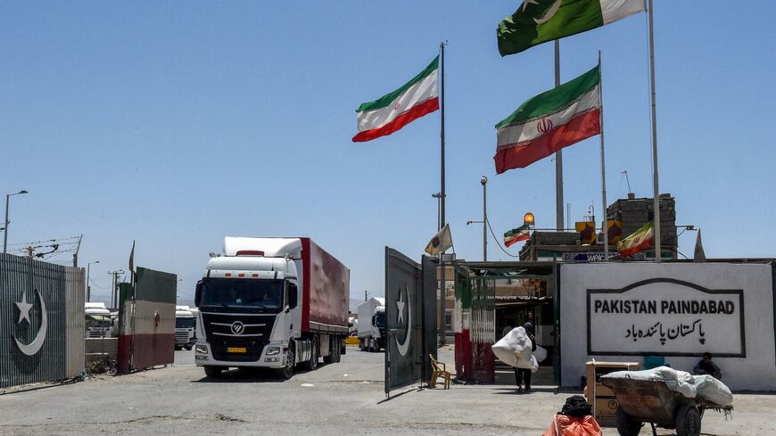 Iranian cargo trucks cross into the Pakistan-Iran border at Taftan, Balochistan province, on June 18, 2025, amid the ongoing conflict between Israel and Iran.