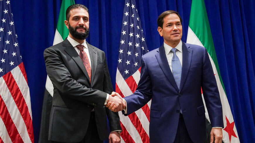 TOPSHOT - US Secretary of State Marco Rubio (R) meets with Syrian President Ahmed al-Sharaa at the Lotte New York Palace Hotel on the sidelines of the United Nations General Assembly meeting in New York City on September 22, 2025. (Photo by Bing Guan / POOL / AFP via Getty Images)