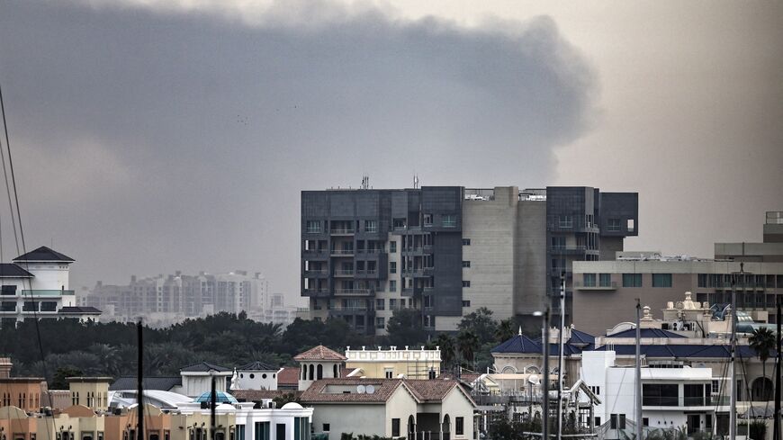 Explosions rattled buildings in Dubai and a large cloud of smoke hung over a central area of the Middle East financial hub on March 13, 2026.