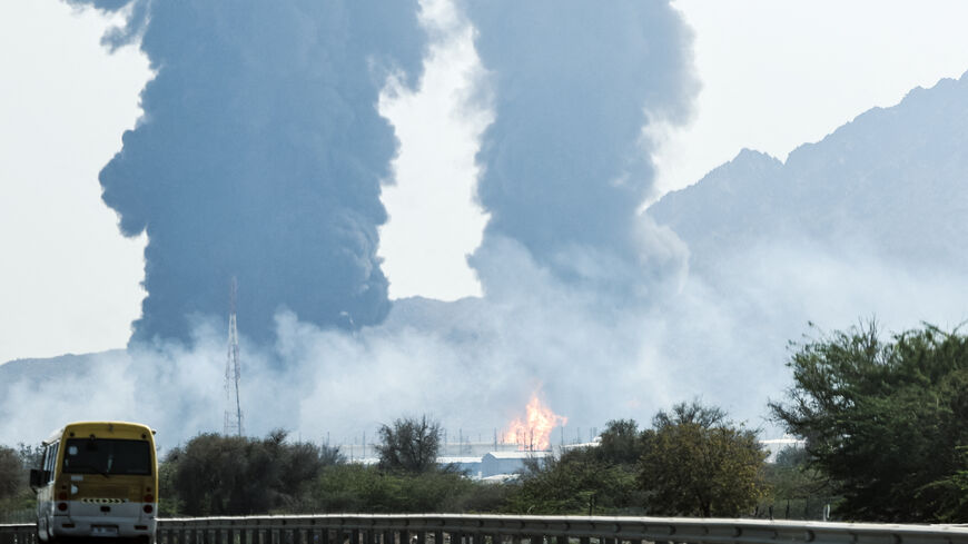Smoke and flames rise from an energy installation in the Gulf emirate of Fujairah on March 14, 2026. Smoke could be seen rising from the direction of a major UAE energy installation on March 14, in what appeared to be the latest strike targeting the Gulf's petroleum facilities hours after the US struck Iran's Kharg Island. (Photo by AFP via Getty Images) /